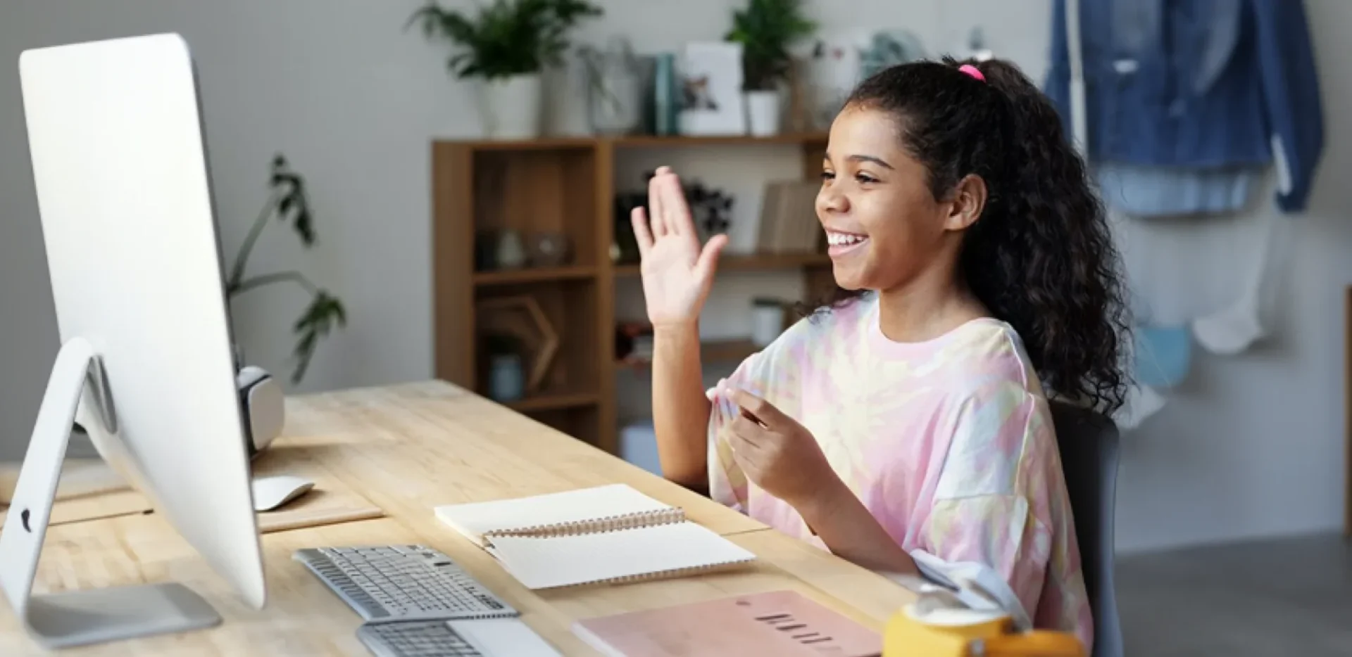 student raises hand in class